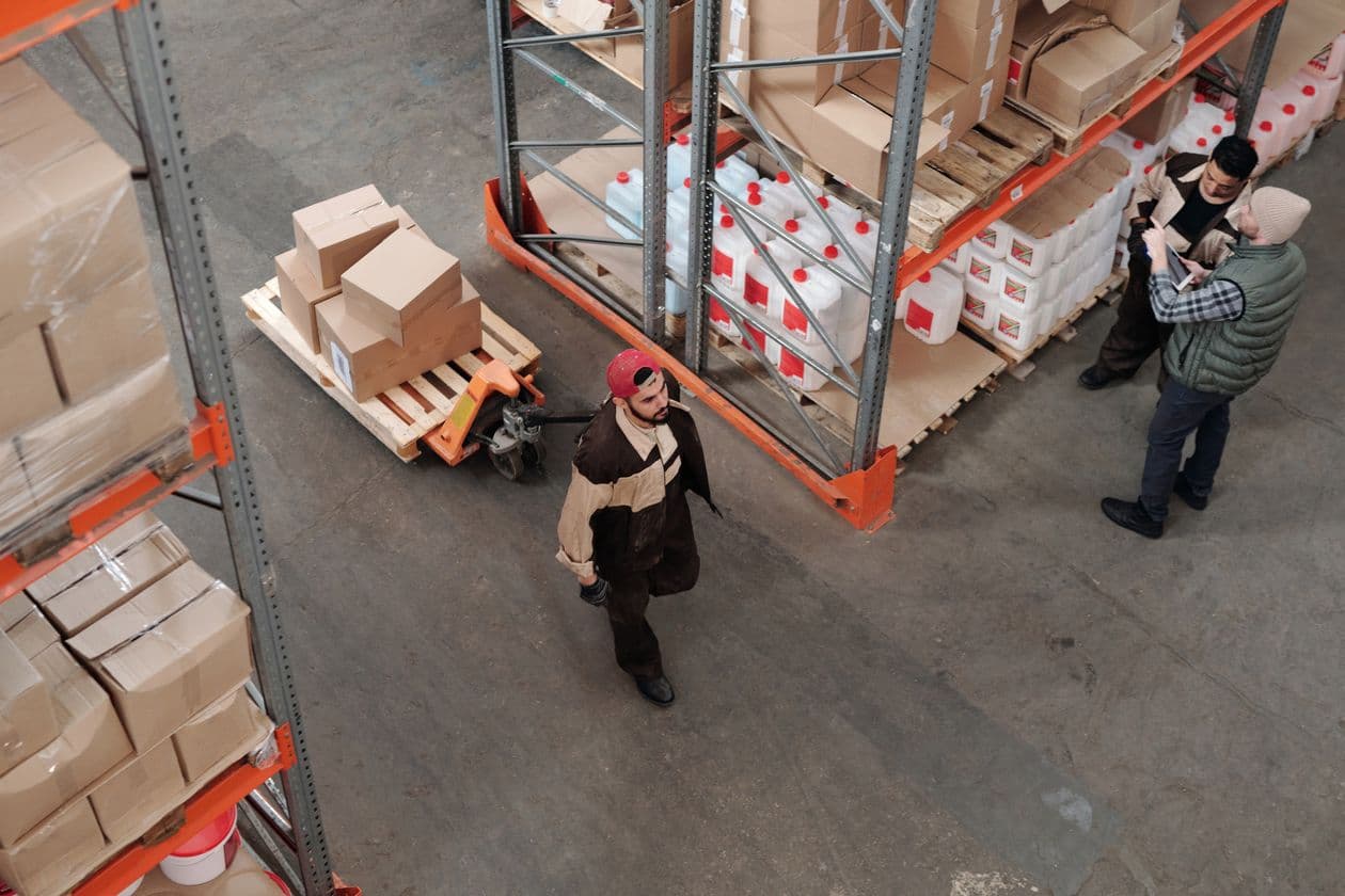 Warehouse with workers, pallets and boxes