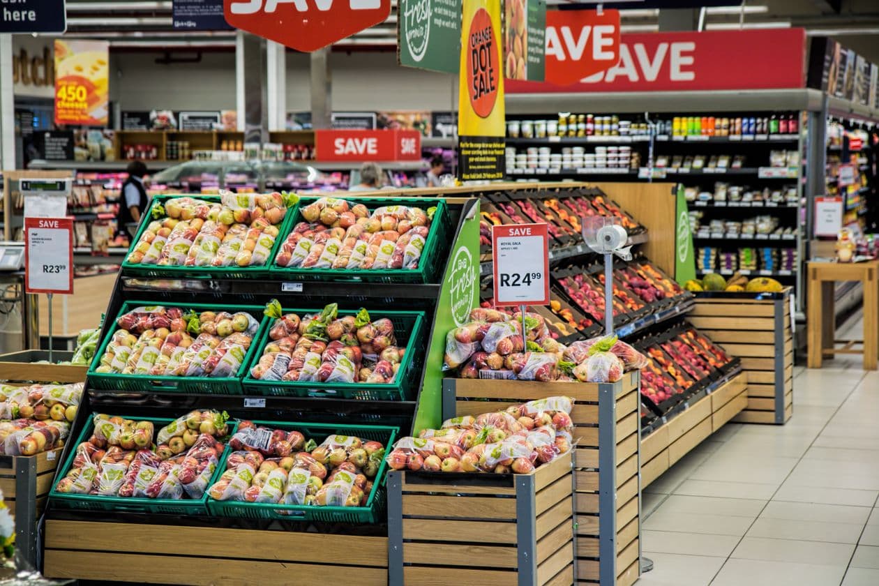Supermarket aisle with promotional placements and signage