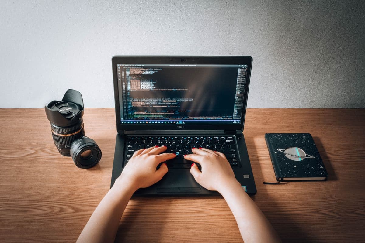 Shopper at a checkout counter, where loyalty redemption happens. Photo: Pexels, free license.